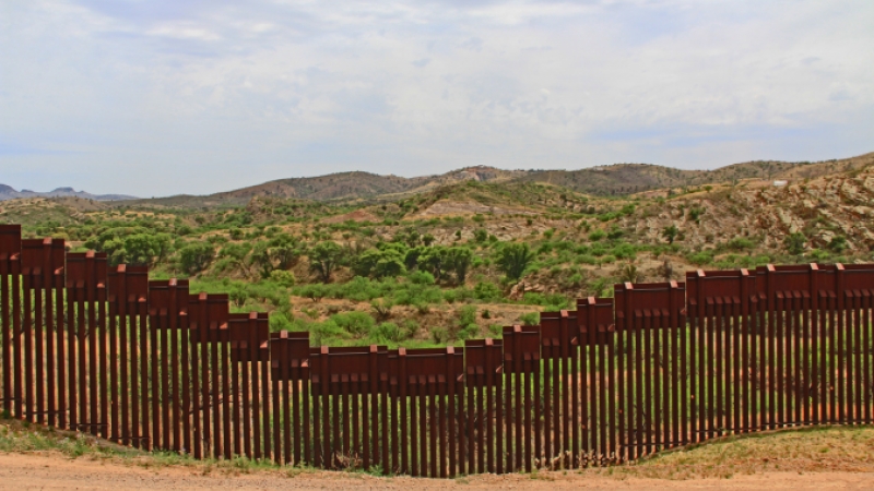 Border Fence Separating the US from Mexico Near Nogales, Arizona. Image copyright: Linda Johnsonbaugh