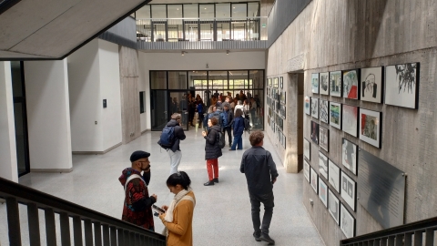 people walking in a gallery space